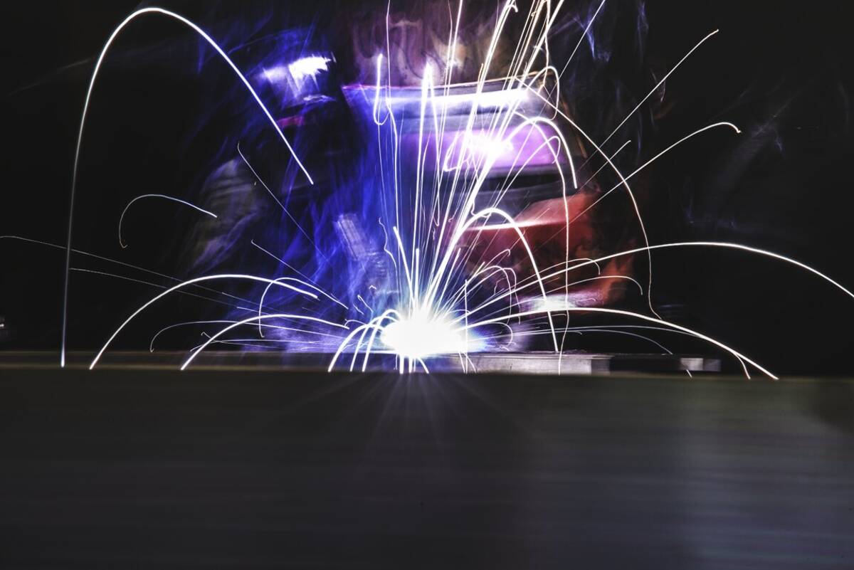Sparks flying during fabrication work in the Illumiletter shop